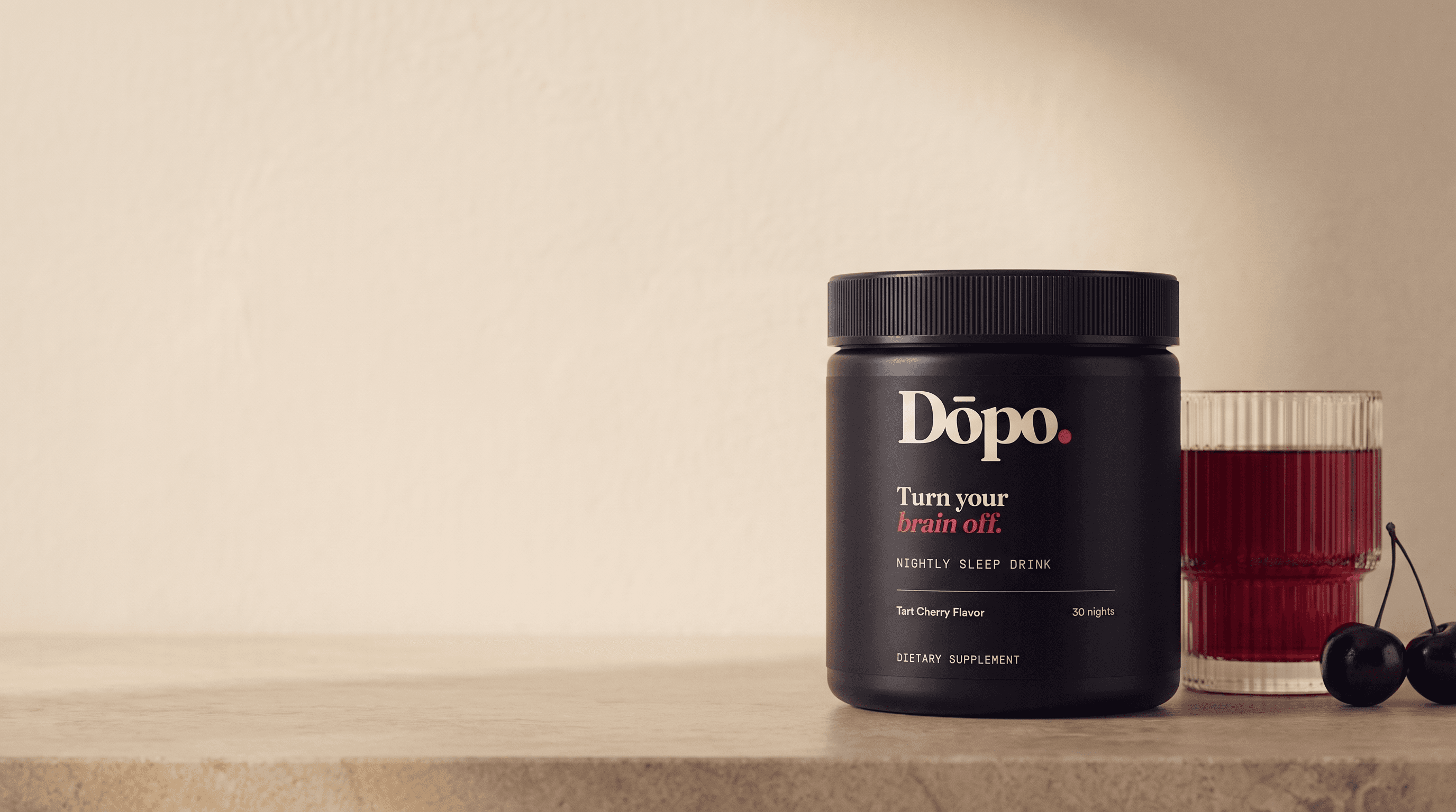 Dōpo Tart Cherry nightly sleep drink tub and ruby drink on a warm evening table