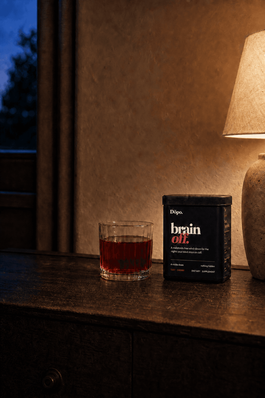 The black Dōpo Brain Off tub beside a ruby drink
