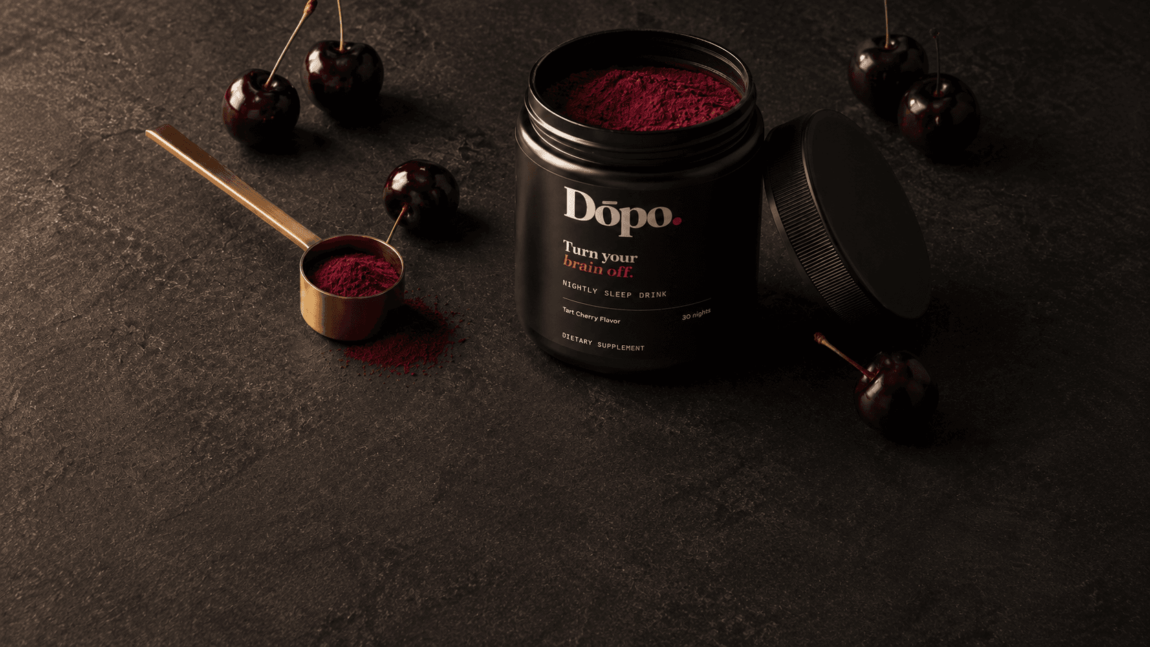 An open Dōpo tub and a scoop of ruby-colored powder, ready to mix with water